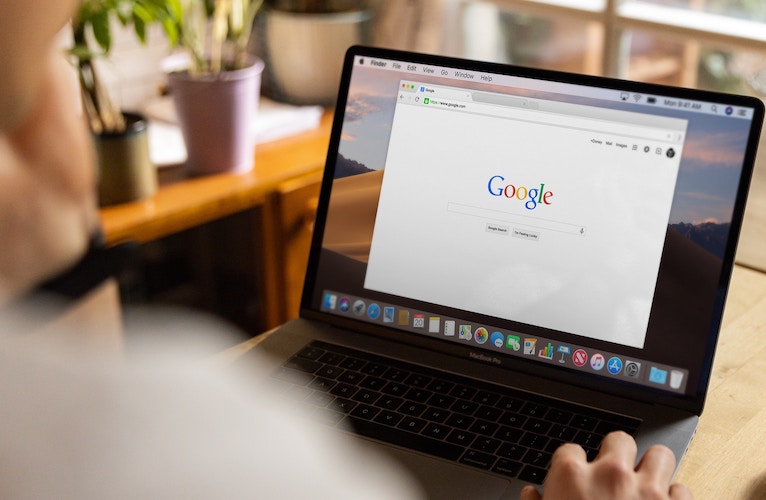 laptop displaying google home page
