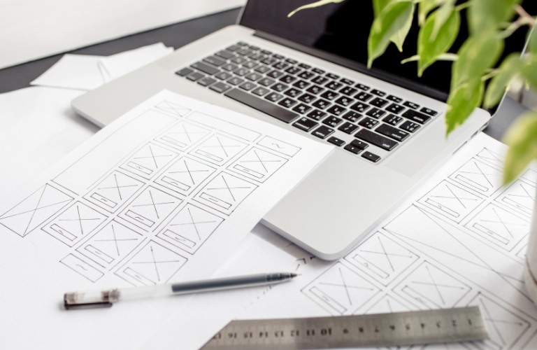 website sketch sheet laying on a laptop